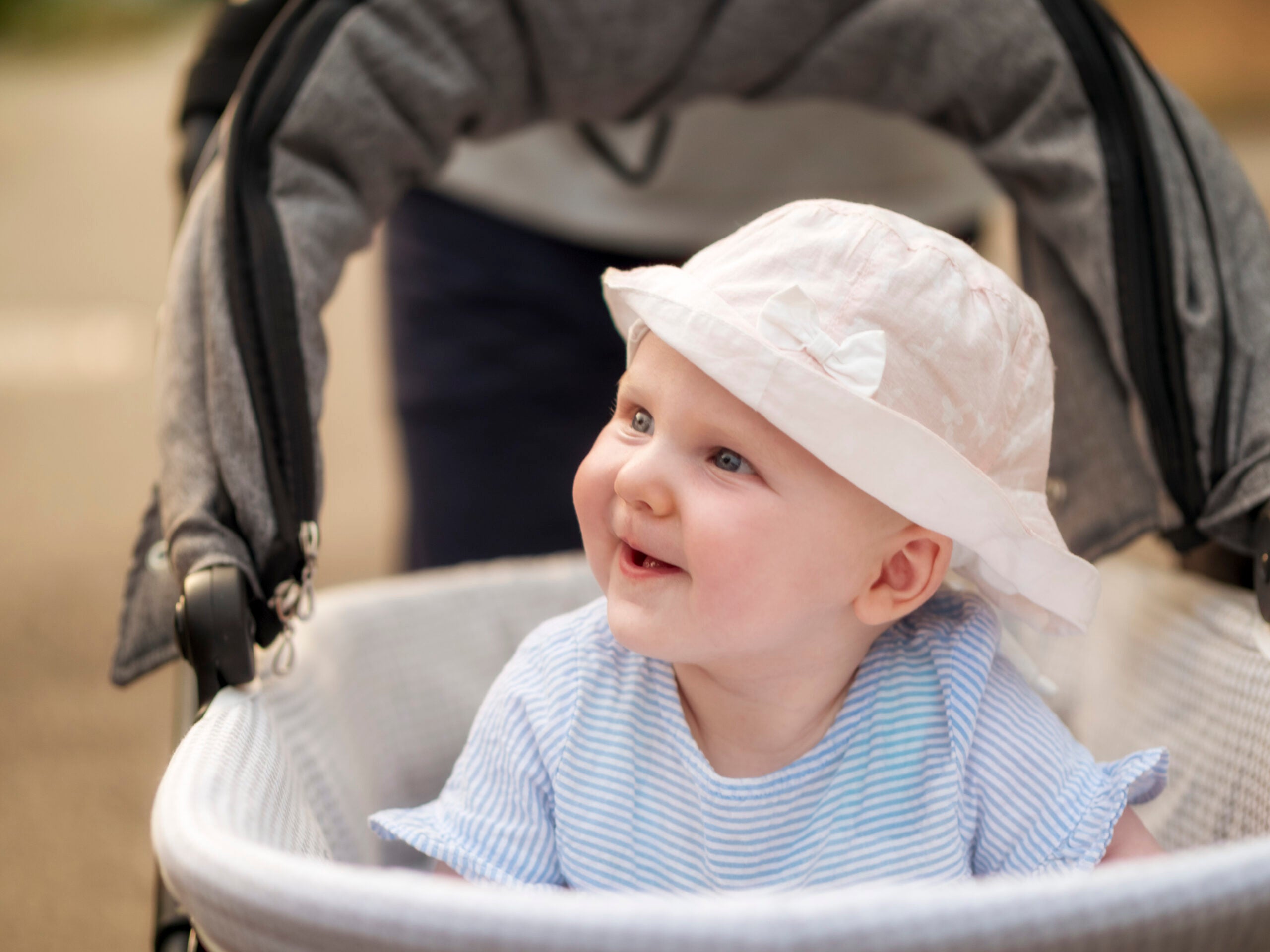 Portrait of relaxed baby girl in pram